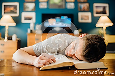 Bored lazy student at home studying.Online-only learning classes homework.Exam material understanding problem.Difficult Stock Photo