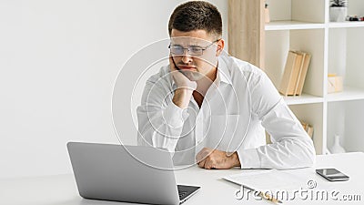 bored man disinterested work silly tasks skeptic Stock Photo