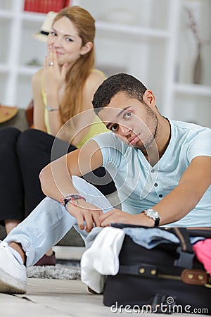 Bored man preparing for travel vacation Stock Photo