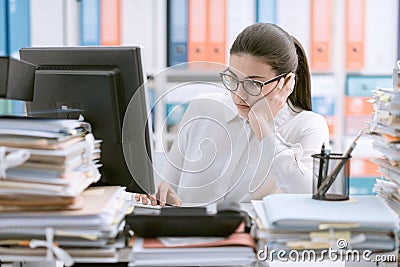 Bored office worker sitting at desk Stock Photo