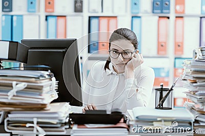 Bored office worker sitting at desk Stock Photo