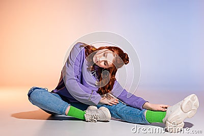 Bored teen girl with red hair Stock Photo