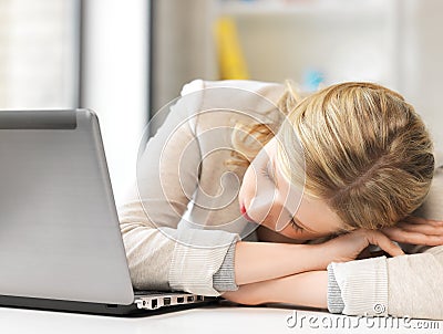 Bored and tired woman sleeping on the table Stock Photo