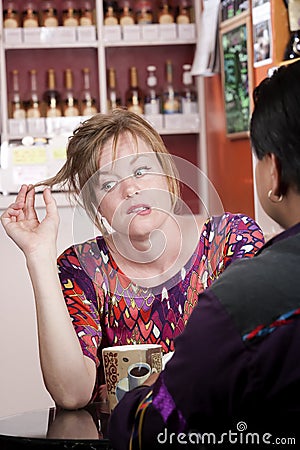 Bored woman in coffee house with male friend Stock Photo