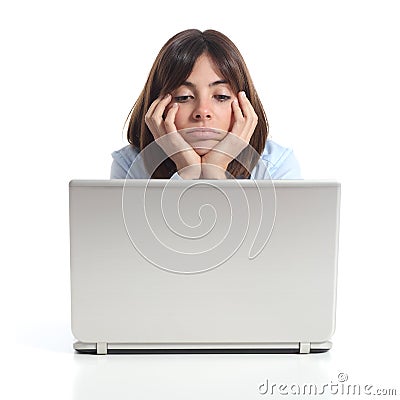 Bored woman watching a laptop Stock Photo