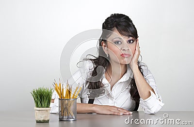 Bored woman at work Stock Photo