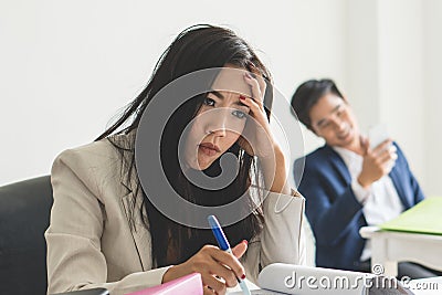 Boredom office work. Asian employee feeling bored her job at workplace and want to change the job Stock Photo
