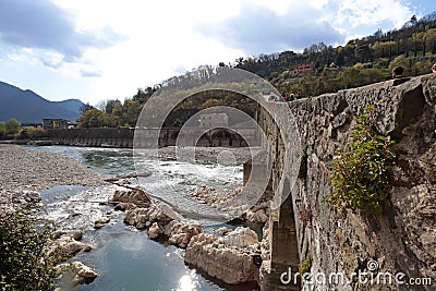 The Ponte della Maddalena or Ponte del Diavolo in Borgo a Mozzano in the province of Lucca, Tuscany, Italy. Editorial Stock Photo