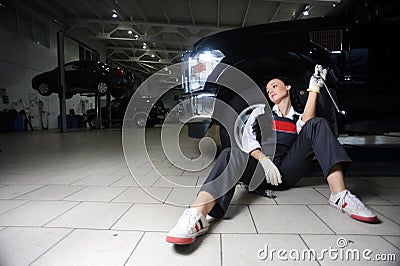 Boring young girl in repair centre Stock Photo