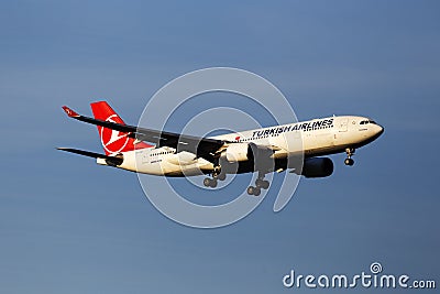 TC-JNA Turkish Airlines Airbus A330-203 aircraft in the sunset rays on the blue sky background Editorial Stock Photo