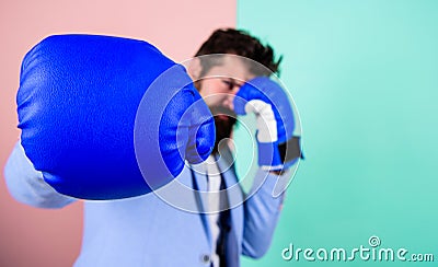 Born to fight. Boxing glove and blurred businessman in formal wear. Fighting for success in sport and business. Bearded Stock Photo