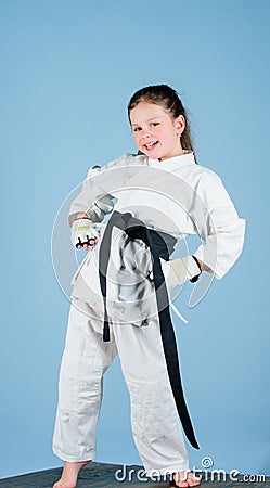 Born to fight. practicing Kung Fu. happy childhood. small girl in martial arts uniform. sport success in single combat Stock Photo