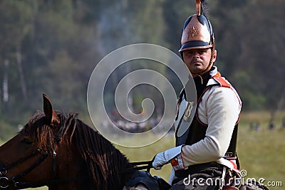 Reenactor rides a horse at Borodino battle historical reenactment in Russia Editorial Stock Photo