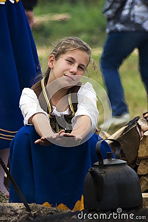 Young reenactor and pot at Borodino battle historical reenactment in Russia Editorial Stock Photo