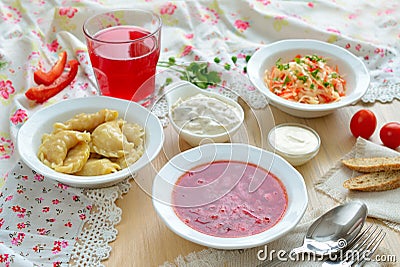 Borsch and vareniki. Traditional Ukrainian lunch. Stock Photo