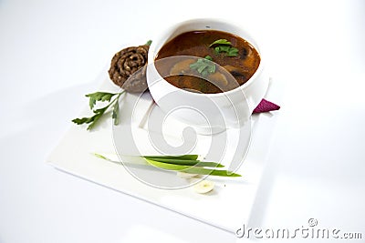 Borscht with pampushka, onion and garlic. Plate on a white background Stock Photo