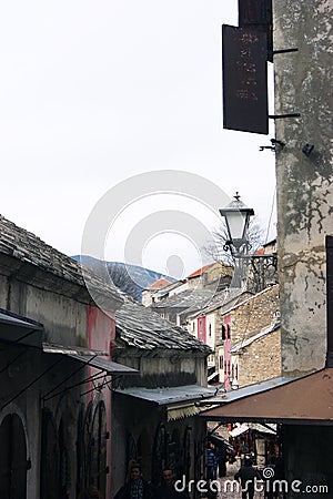 Bosnia and Herzegovina, Mostar - 07/08/2015: View of the historic shopping streetÂ  Kuyunzhiluk. Editorial Stock Photo