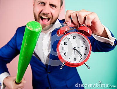 Boss aggressive face hold alarm clock and baseball bat. Man suit hold clock in hand and arguing for being late. Business Stock Photo
