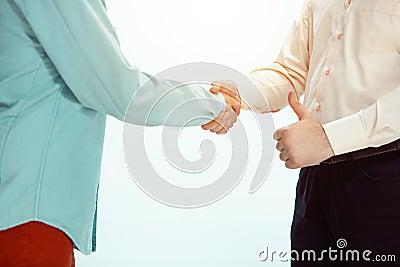 Boss approving and congratulating young successful employee Stock Photo