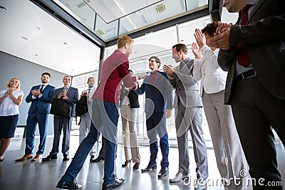 Boss congratulate to his employer Stock Photo