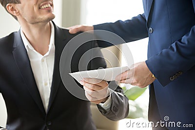 Boss congratulating employee with getting reward Stock Photo