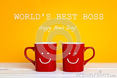 Boss day greeting card with two red coffee mugs with a smiling f Stock Photo