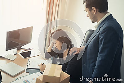 Boss giving Consolation to a stressed office worker Stock Photo