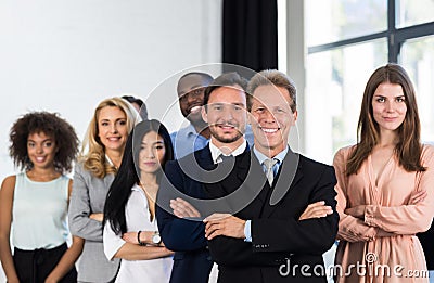 Boss With Group Of Businesspeople In Creative Office, Mature Successful Businessman Leading Business People Team Stand Stock Photo