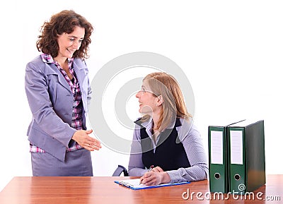 Boss woman explaing to her assistant happily Stock Photo
