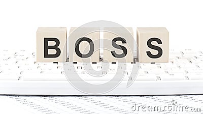 BOSS -word wooden block on keyboard background witn chart Stock Photo