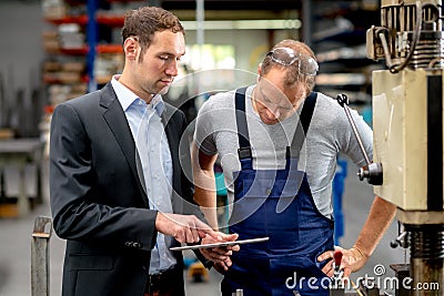 Boss and worker in conversation Stock Photo