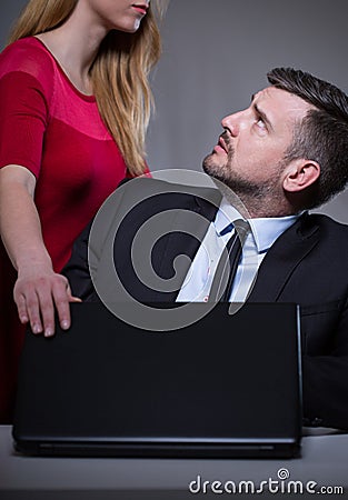 Bossy assistant and confused man Stock Photo