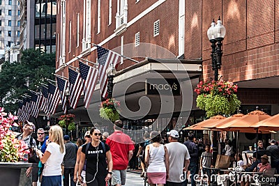 Boston, MA USA 06.09.2017 - Macy`s Shopping Mall Store with people walking and american flag waving Editorial Stock Photo