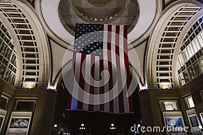 Boston, USA - October 22, 2021: American flag hanging at night from the doom ceiling in Boston Harbor, Massachusetts Editorial Stock Photo