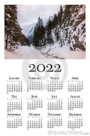 Botanical calendar for 2022. Printable wall calendar, week starts on Monday. Beautiful winter landscape in the Polish mountains Stock Photo