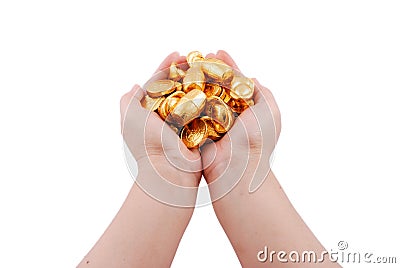 Both hands holding gold coins Stock Photo