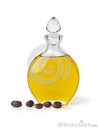 Botle of Jojoba oil and seeds Stock Photo