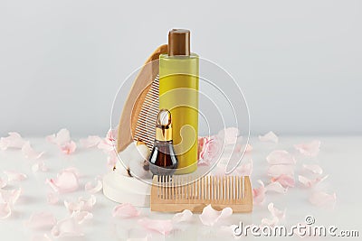 Bottle with beauty product, dropper bottle with natural oil, comb Stock Photo