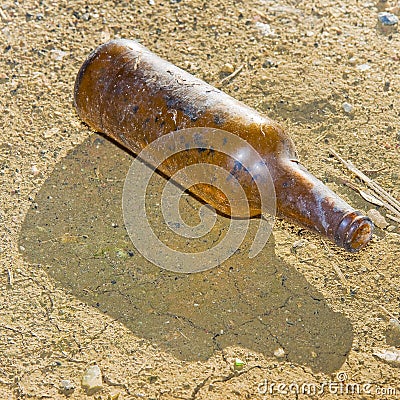 Bottle of beer glass abandoned on the gound Stock Photo