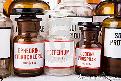 Bottle with caffeine among other vintage medicine bottles Stock Photo