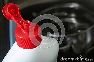 Bottle cap of dish soap on background of sink with dishes Stock Photo