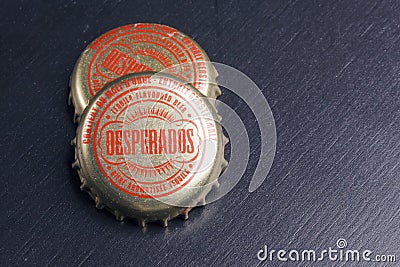 Bottle caps of Desperados beer. Editorial Stock Photo
