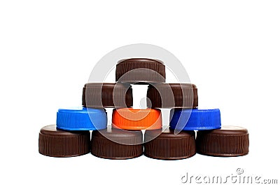 A tower is built from plastic covers on a white isolated background. Stock Photo