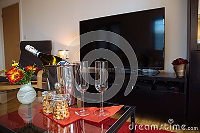 Bottle of chilled champagne on a coffee table in the living room. Editorial Stock Photo