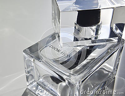 The bottle of Christian Dior Homme perfume with the sunlight going through Editorial Stock Photo