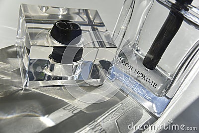 The bottle of Christian Dior Homme perfume with the sunlight going through Editorial Stock Photo