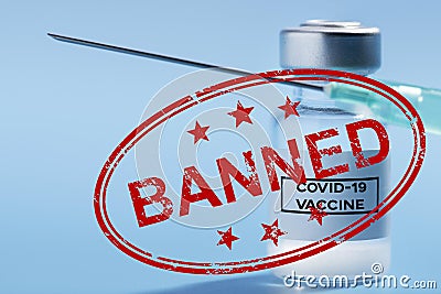 Bottle of covid 19 vaccine on a blue background with a banned sign Stock Photo