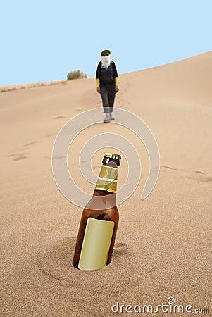 Bottle in desert Stock Photo