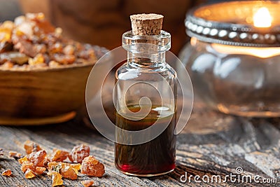 A bottle of essential oil with myrrh resin Stock Photo