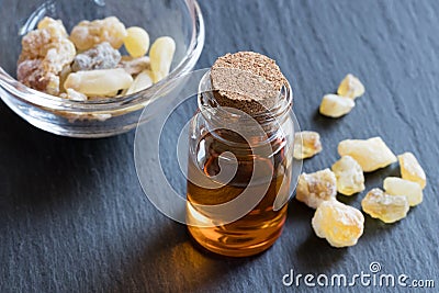 A bottle of frankincense essential oil with frankincense crystal Stock Photo